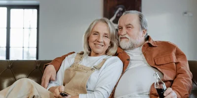 Happy Older Couple Relaxing at Home After Downsizing