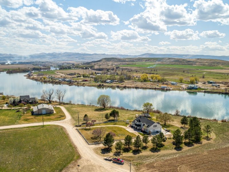 Waterfront home on the Snake River in Idaho with mountain views, listed by Top Idaho Real Estate