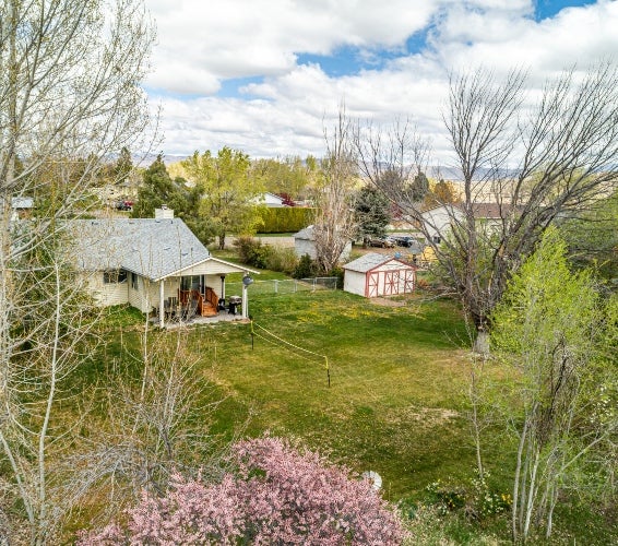 Mountain Home Idaho home with large backyard and mature trees